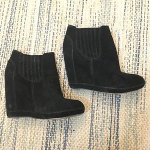 Black heeled wedge booties
